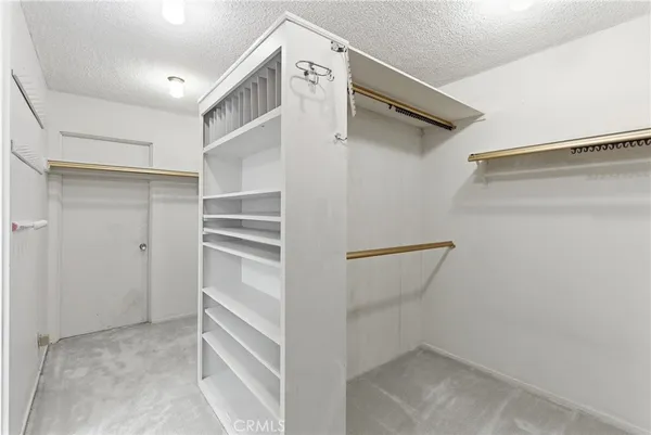 a bathroom with double vanity a mirror a double vanity sink and a mirror