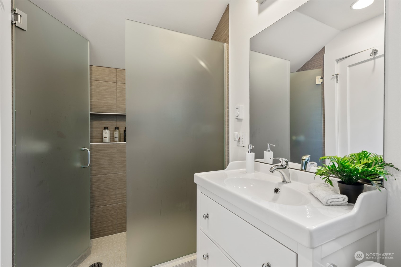 2506 Walnut Avenue Southwest Seattle, WA 98116 - Photo 18 of 29 a bathroom with a sink a toilet and a mirror