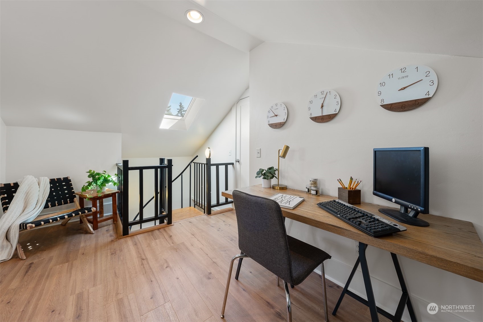 2506 Walnut Avenue Southwest Seattle, WA 98116 - Photo 19 of 29 a view of a workspace with furniture and wooden floor