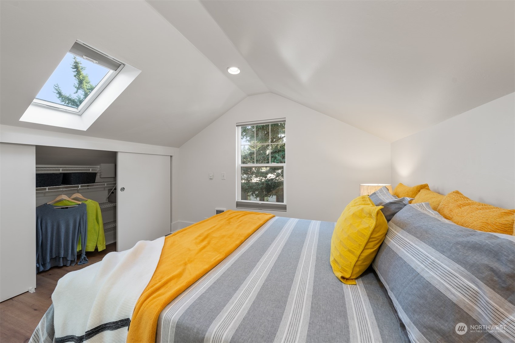 2506 Walnut Avenue Southwest Seattle, WA 98116 - Photo 20 of 29 a bed sitting in a bedroom next to a window