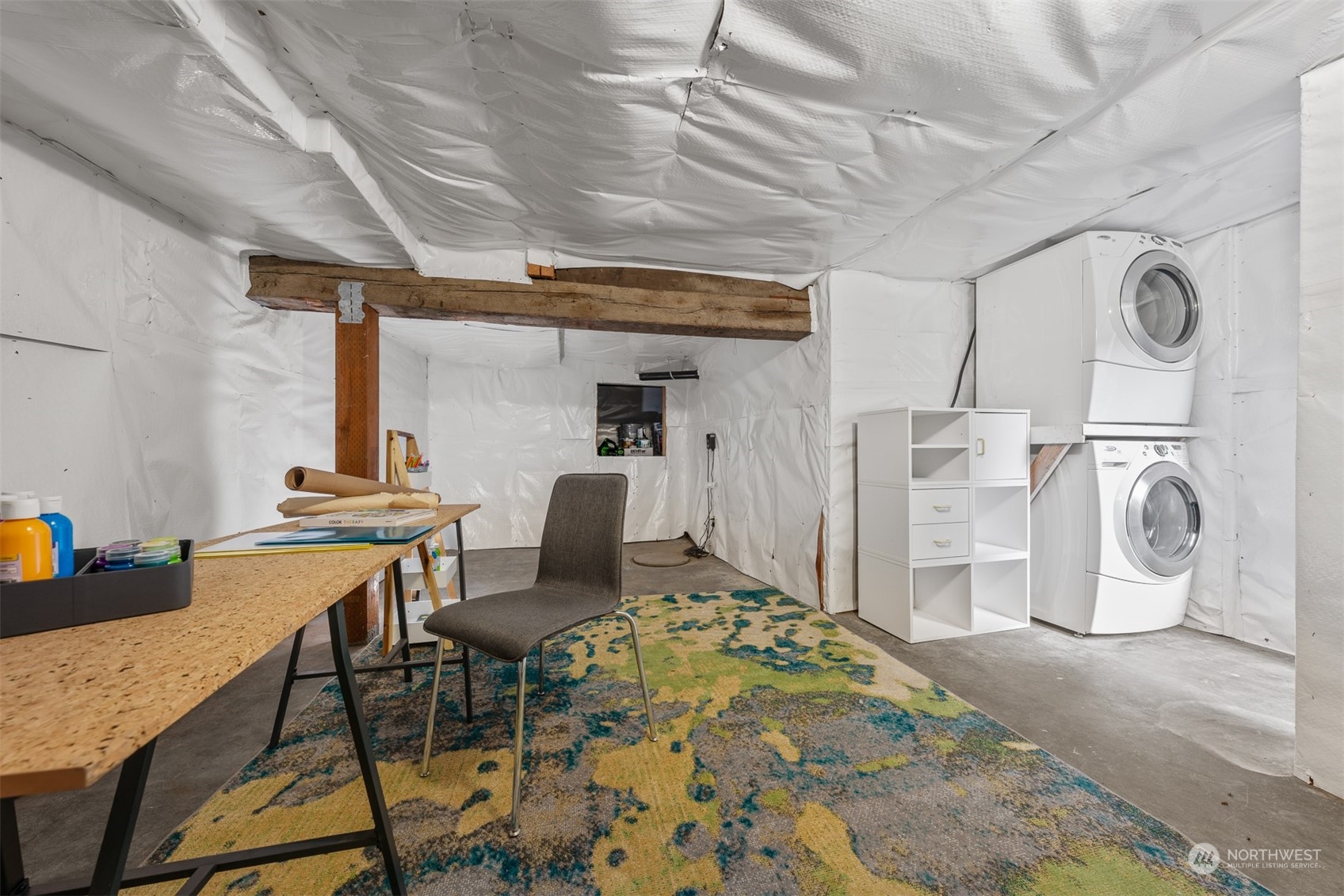 2506 Walnut Avenue Southwest Seattle, WA 98116 - Photo 23 of 29 a room with lots of furniture a rug and white walls