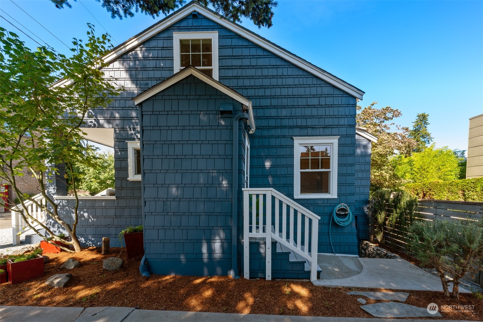 2506 Walnut Avenue Southwest Seattle, WA 98116 - Photo 25 of 29 a front view of a house with a yard