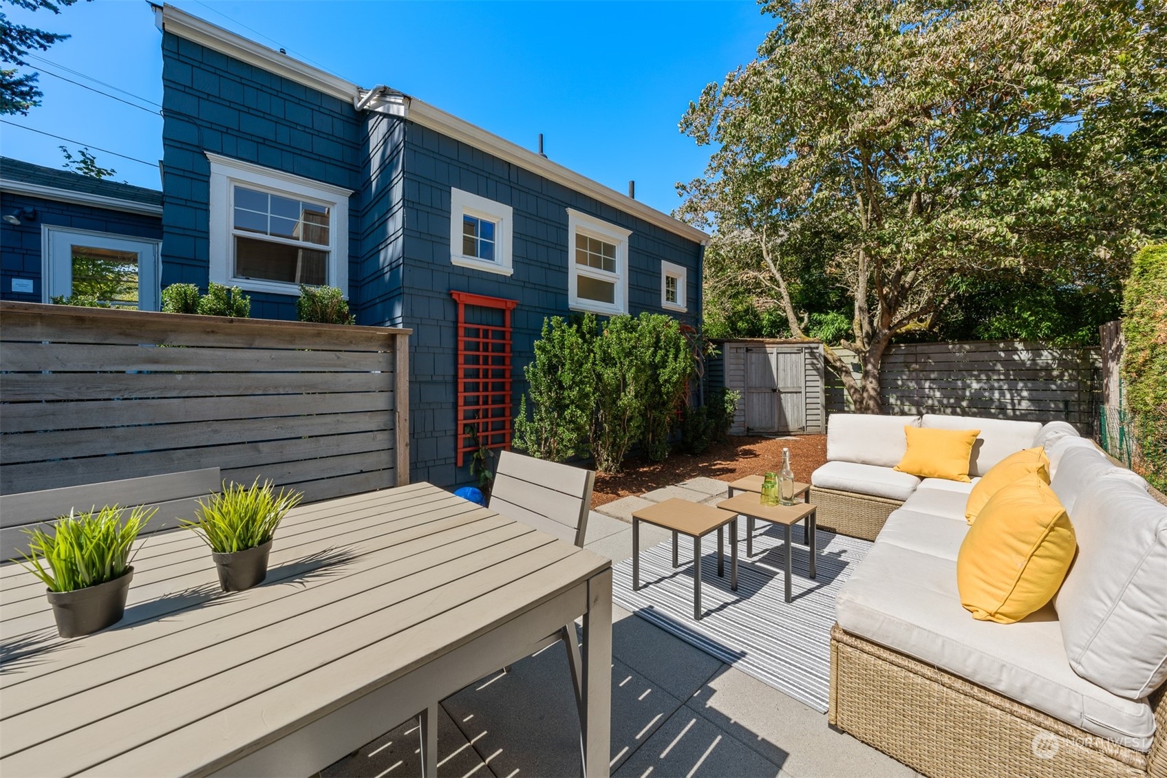 2506 Walnut Avenue Southwest Seattle, WA 98116 - Photo 3 of 29 a view of a patio with couches chairs and a potted plant