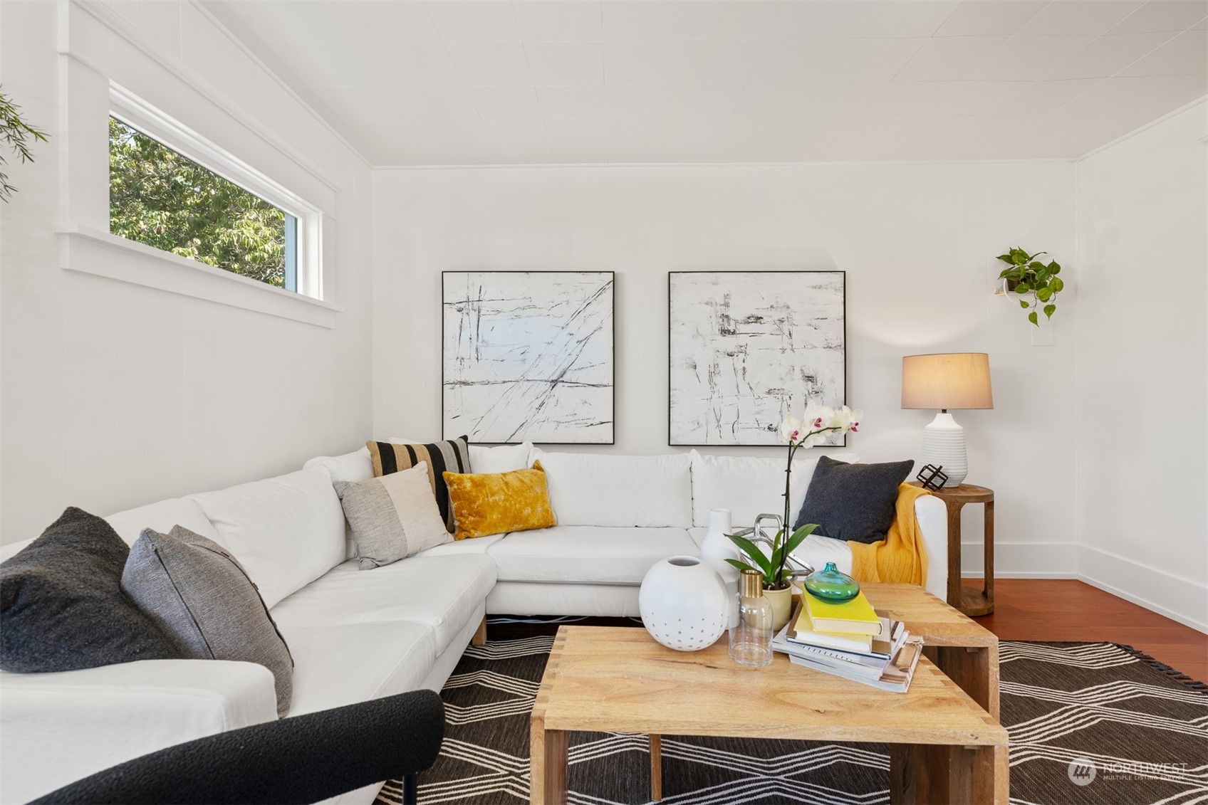 2506 Walnut Avenue Southwest Seattle, WA 98116 - Photo 4 of 29 a living room with furniture and painting on the wall