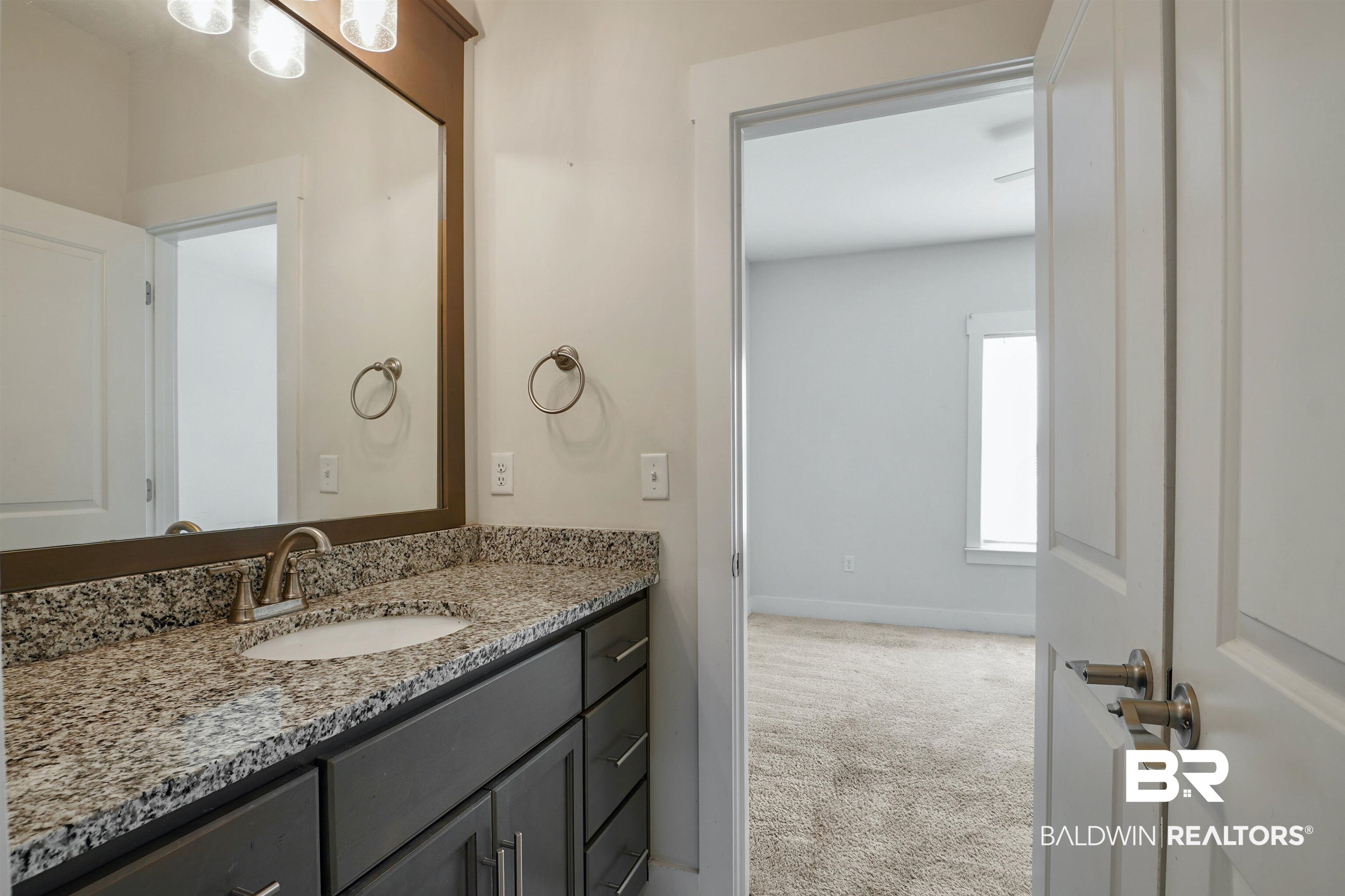 7090 Rocky Rd Loop Gulf Shores, AL 36542 - Photo 20 of 34 Bathroom with baseboards and vanity