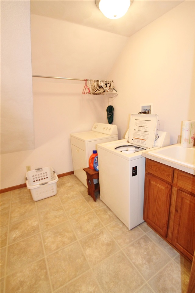 4461 Ridgeview Lane Byron, IL 61010 - Photo 16 of 25 a utility room with dryer and washer