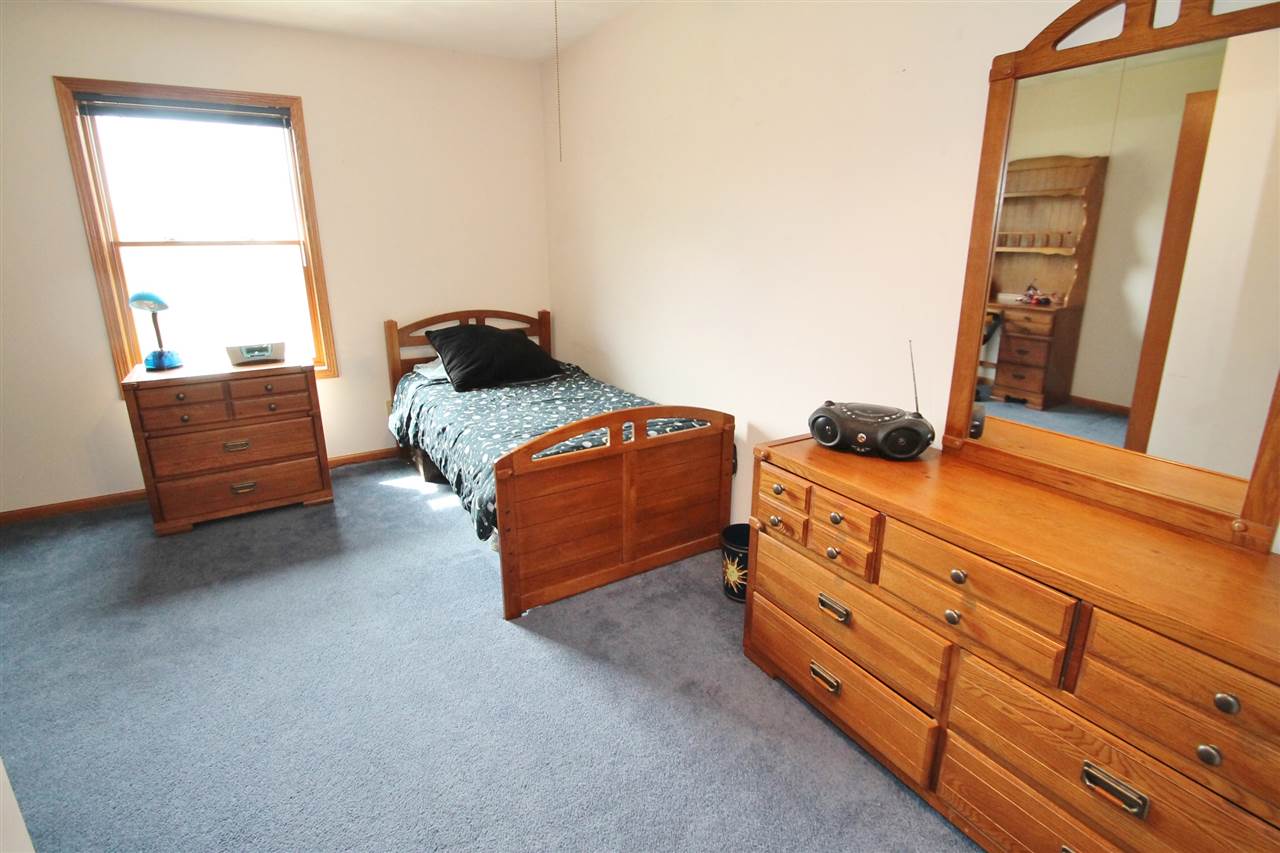 4461 Ridgeview Lane Byron, IL 61010 - Photo 17 of 25 a bedroom with bed and window