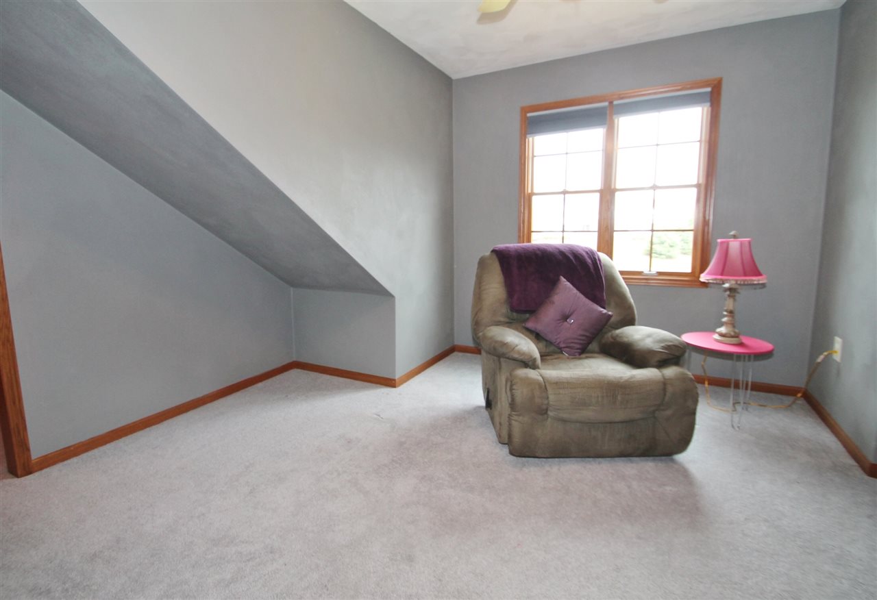 4461 Ridgeview Lane Byron, IL 61010 - Photo 18 of 25 a living room with furniture and a window