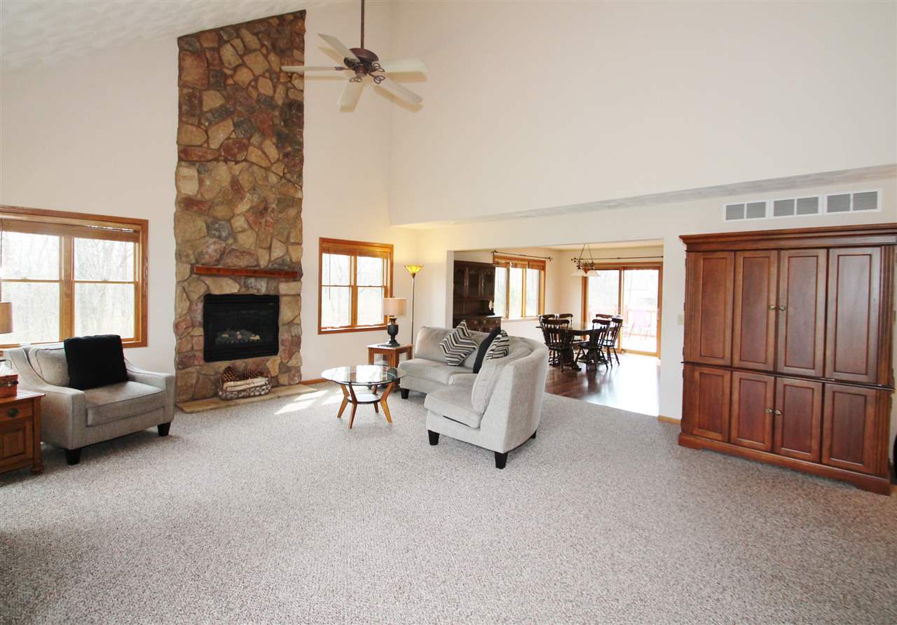 4461 Ridgeview Lane Byron, IL 61010 - Photo 2 of 25 a living room with furniture and a fireplace