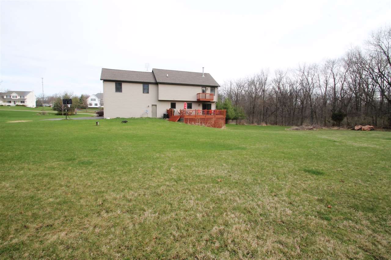 4461 Ridgeview Lane Byron, IL 61010 - Photo 24 of 25 a view of a house with backyard and garden
