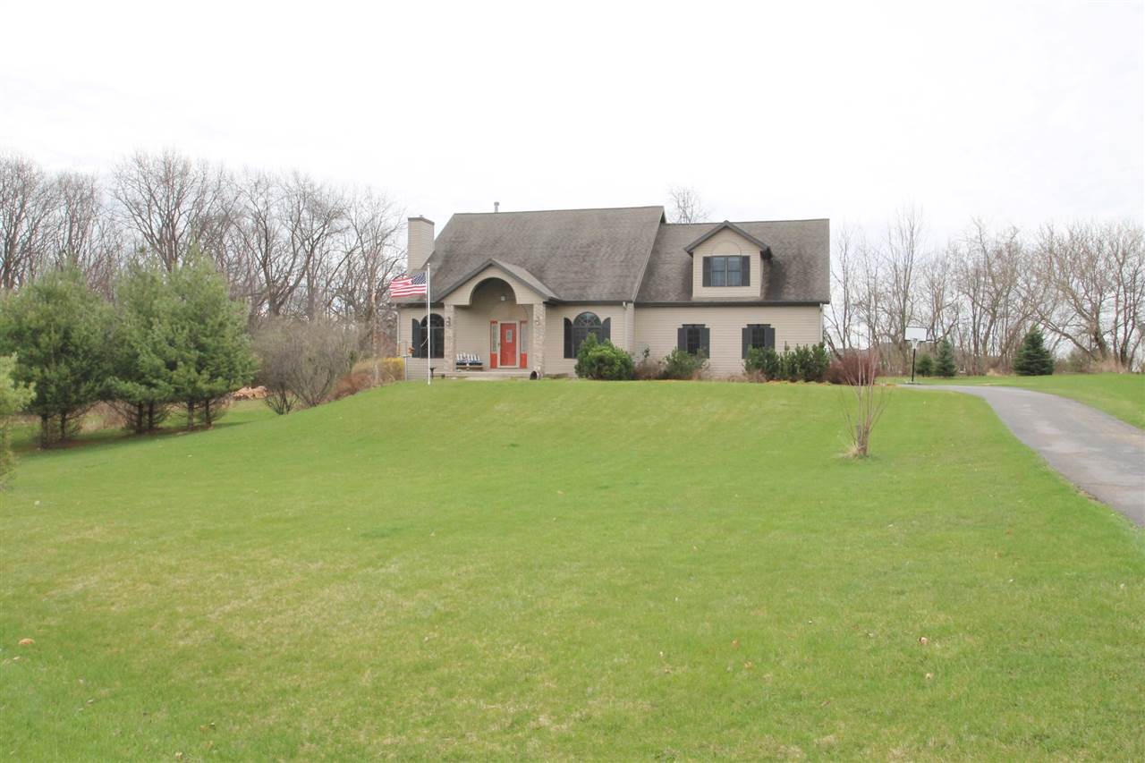 4461 Ridgeview Lane Byron, IL 61010 - Photo 25 of 25 a view of a house with a big yard and large trees