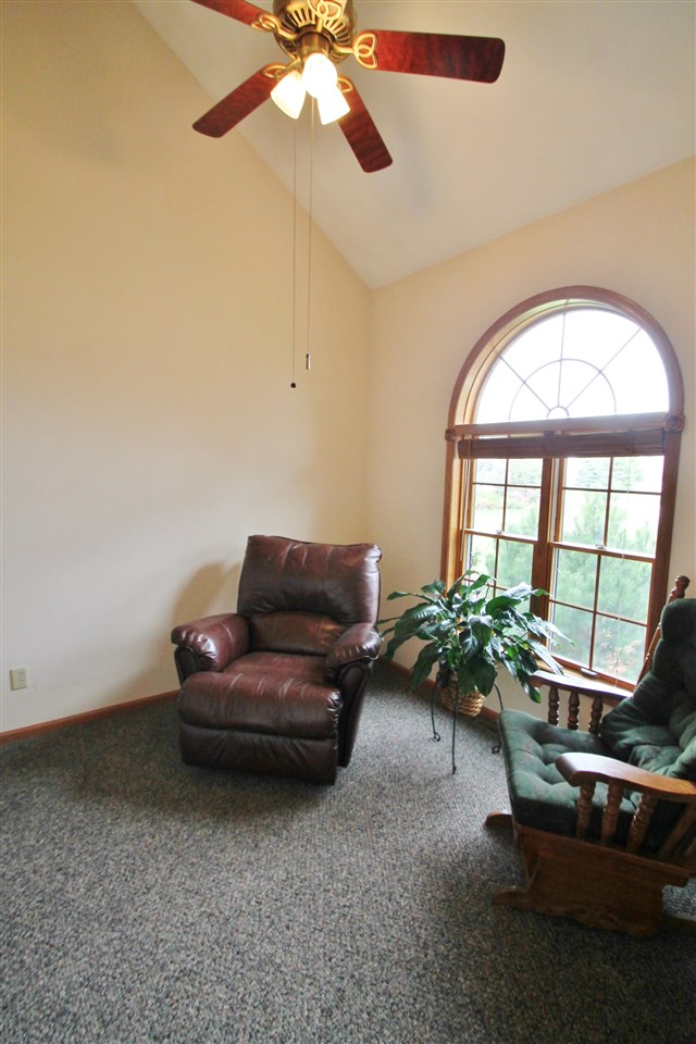4461 Ridgeview Lane Byron, IL 61010 - Photo 10 of 25 a living room with furniture and a large window