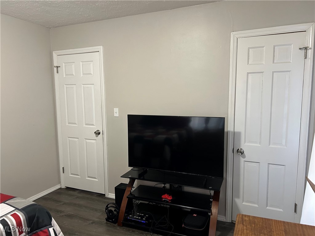 1407 Cranover Road Cleveland, OH 44124 - Photo 19 of 44 Bedroom featuring a textured ceiling and dark hardwood / wood-style floors