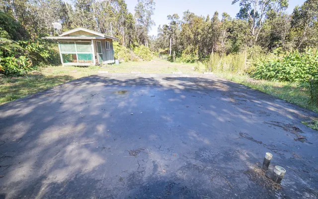 a view of house with outdoor space and garden