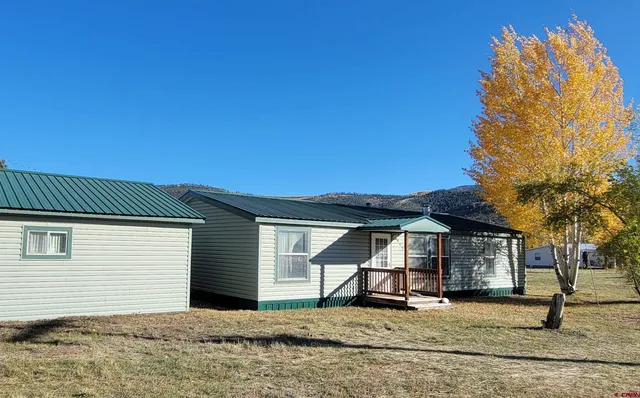 a house with trees in the background