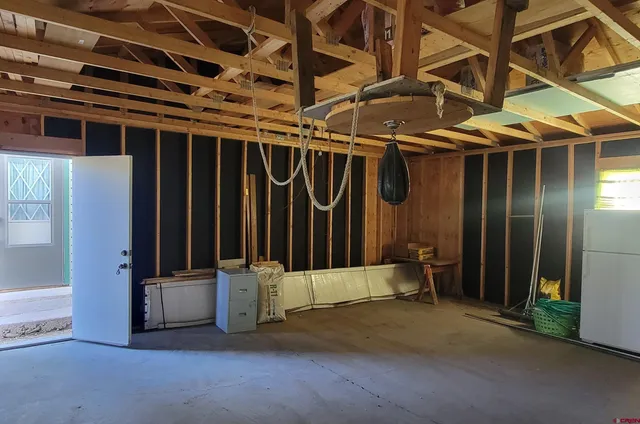 a view of a door with wooden walls