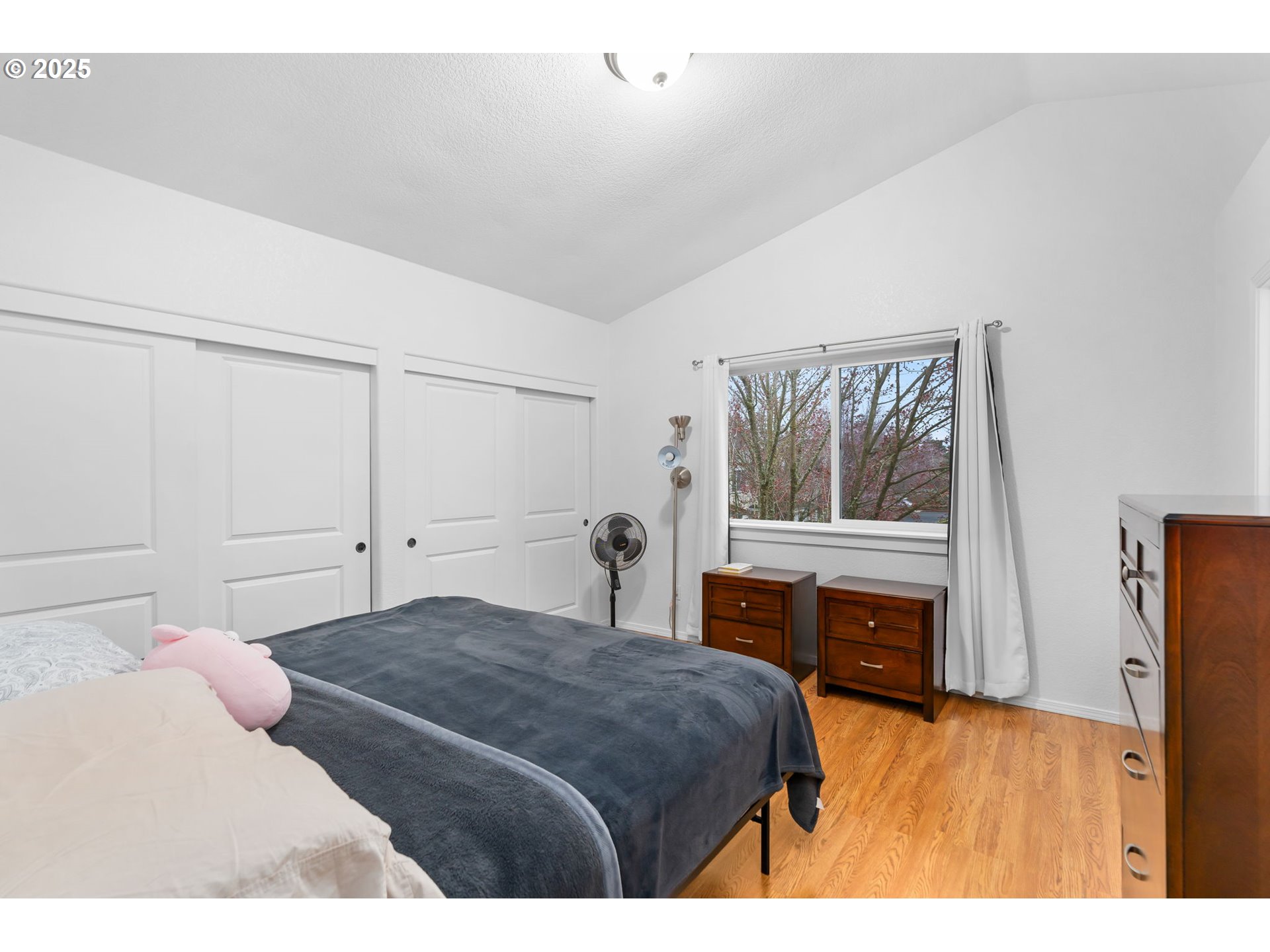 11938 Southeast Market Street Portland, OR 97216 - Photo 18 of 28 a bedroom with a bed and a window