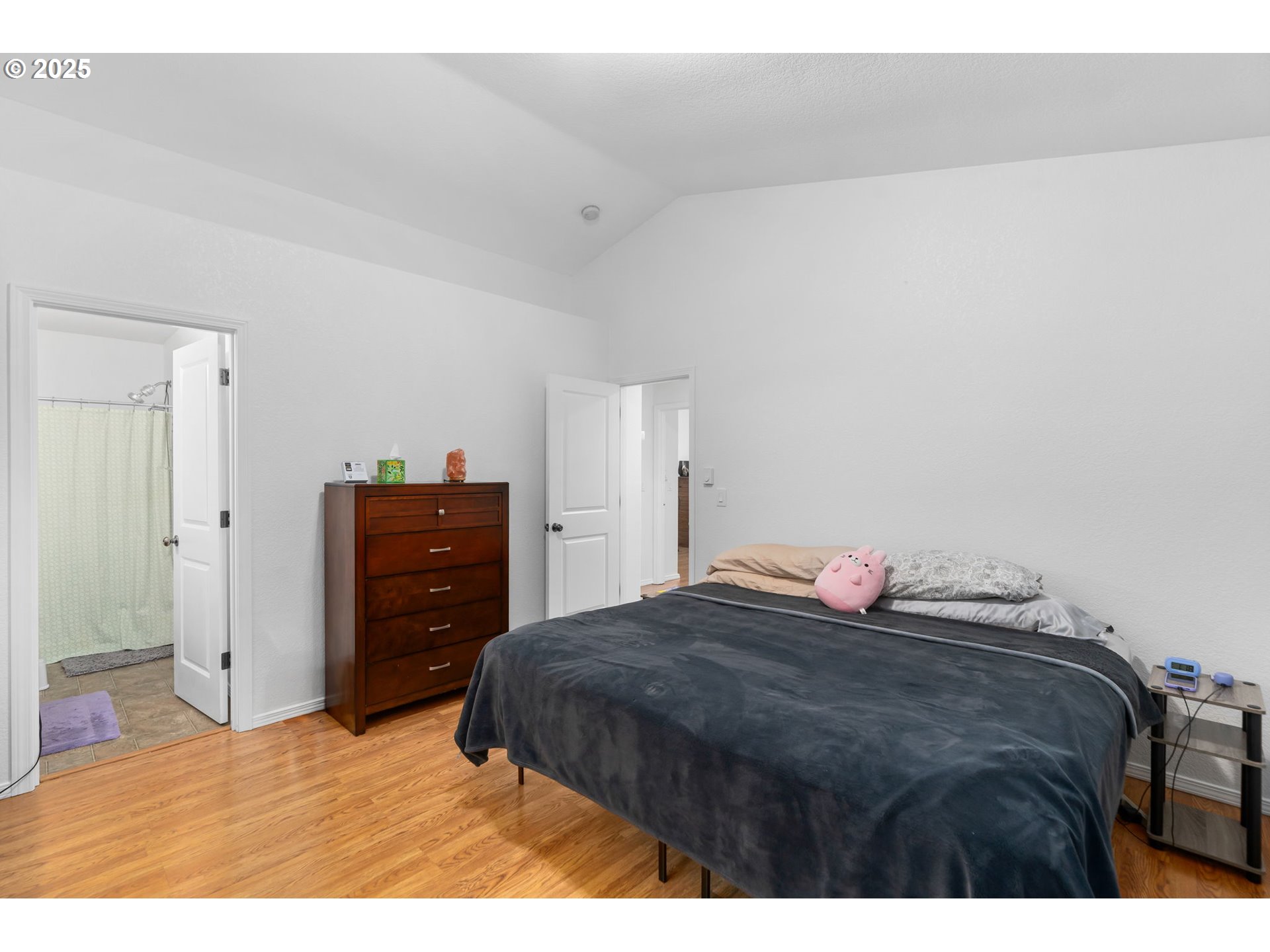 11938 Southeast Market Street Portland, OR 97216 - Photo 19 of 28 a bedroom with a bed and two dressers