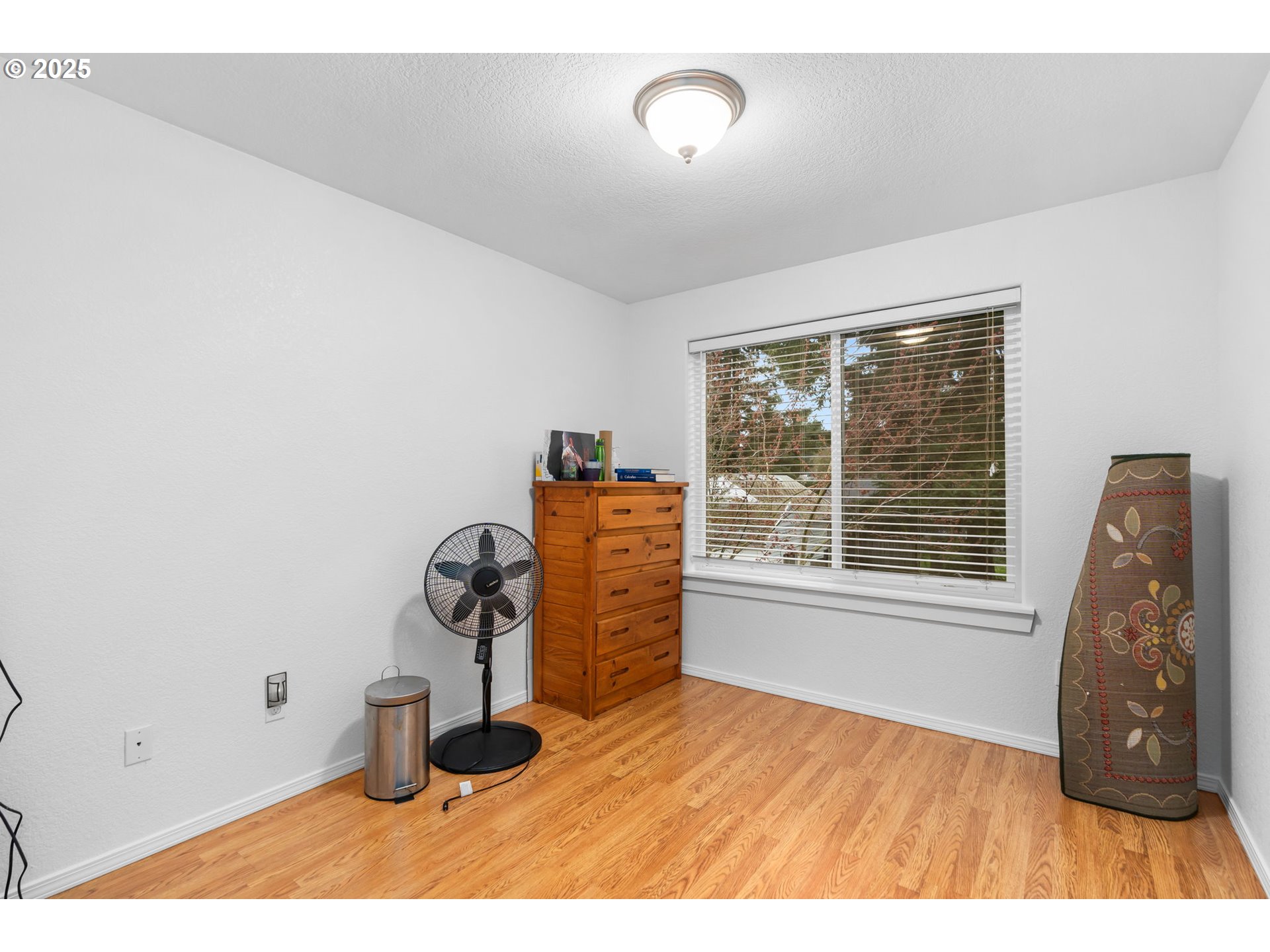 11938 Southeast Market Street Portland, OR 97216 - Photo 22 of 28 a view of a livingroom with wooden floor and a window