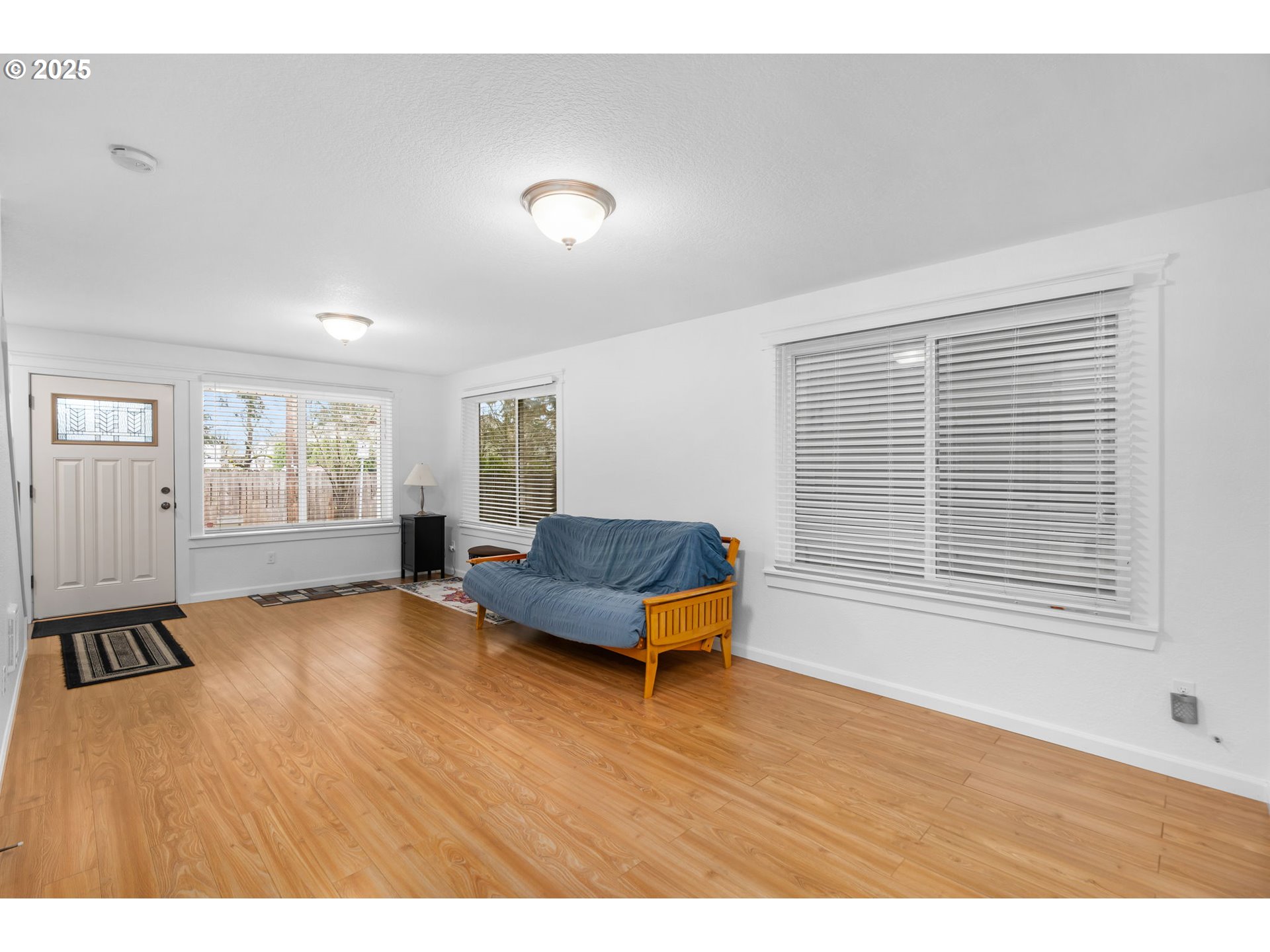 11938 Southeast Market Street Portland, OR 97216 - Photo 7 of 28 a living room with furniture and wooden floor