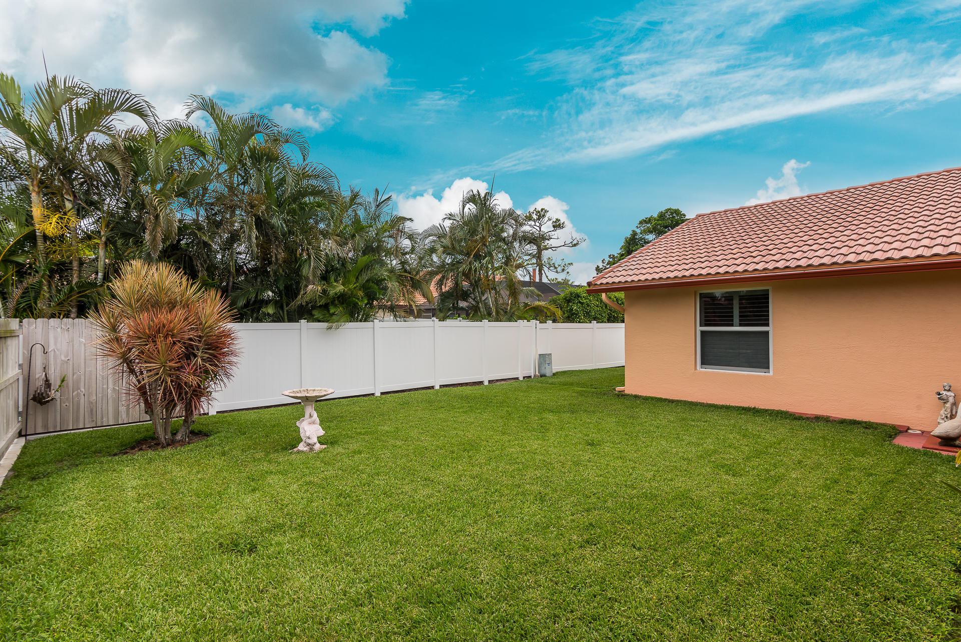 23369 Lago Mar Circle Boca Raton, FL 33433 - Photo 3 of 25 a backyard of a house with lots of green space
