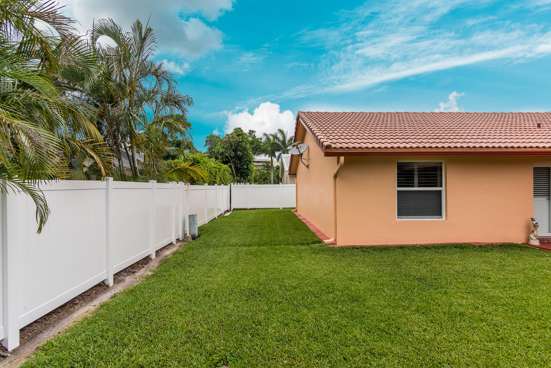 23369 Lago Mar Circle Boca Raton, FL 33433 - Photo 4 of 25 a house with garden in front of it