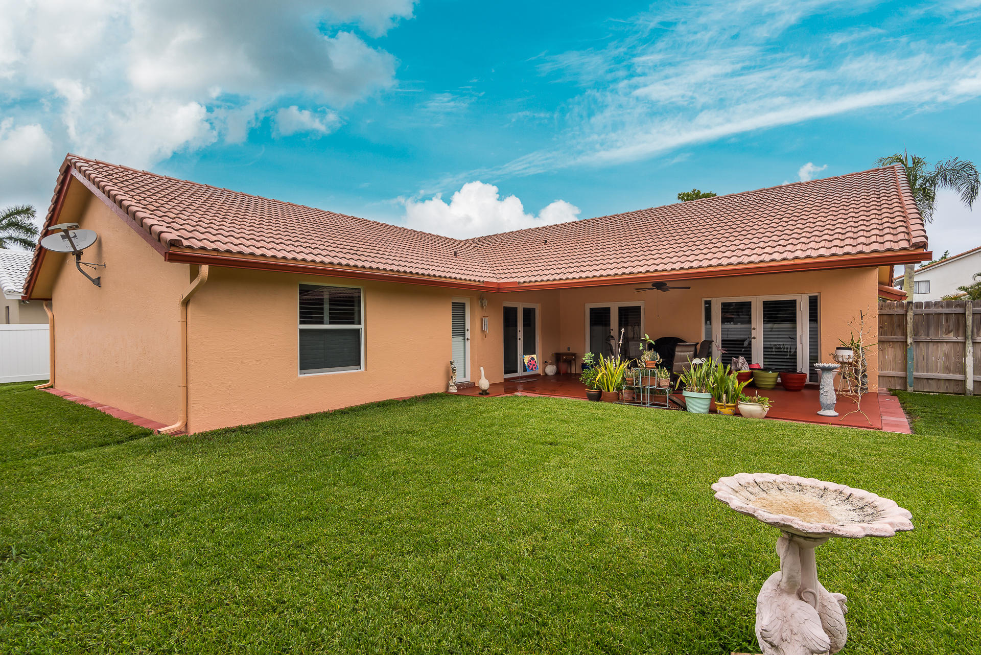 23369 Lago Mar Circle Boca Raton, FL 33433 - Photo 6 of 25 a view of a house with backyard porch and furniture