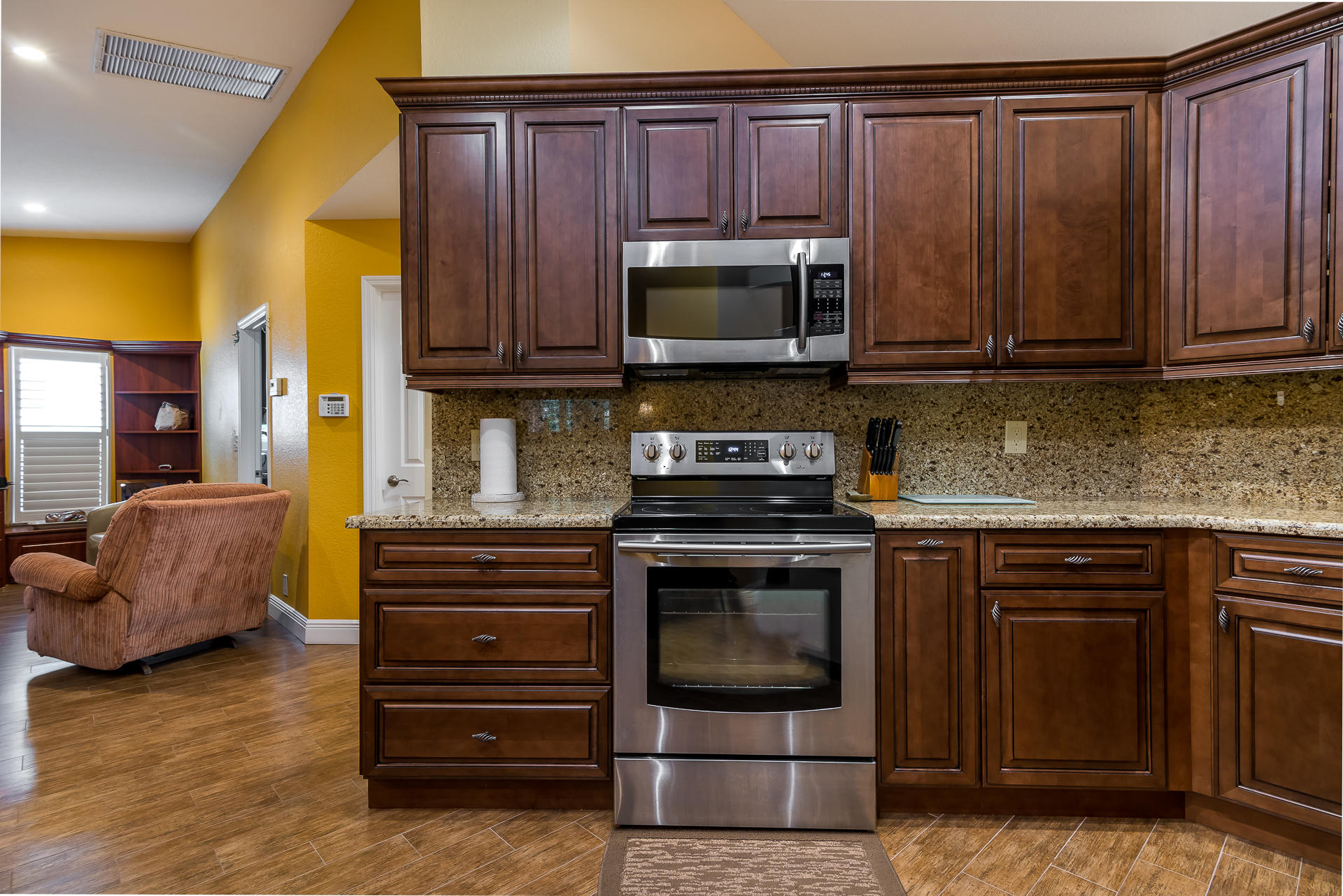23369 Lago Mar Circle Boca Raton, FL 33433 - Photo 8 of 25 a kitchen with stainless steel appliances granite countertop a stove and a microwave