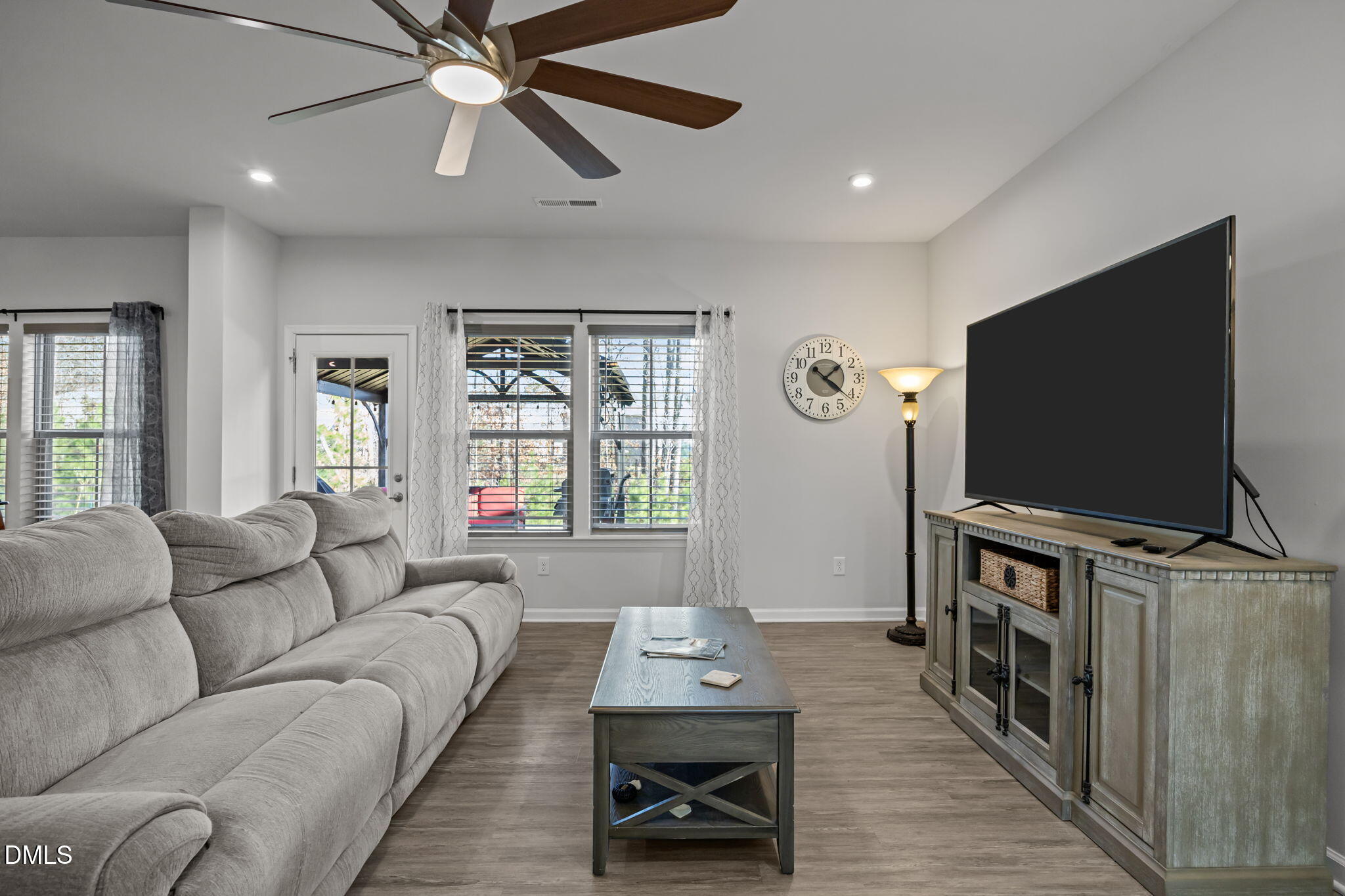 1624 Ripley Woods Street Wake Forest, NC 27587 - Photo 10 of 41 a living room with furniture and a flat screen tv