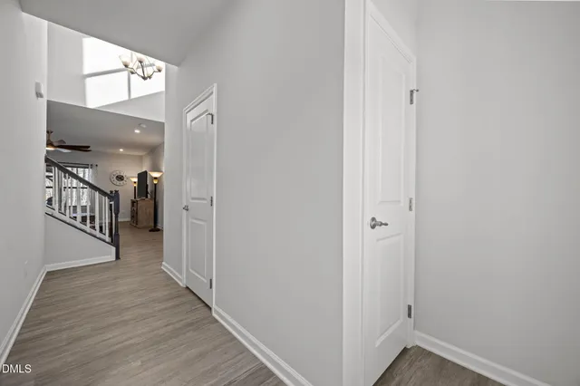 a view of hallway with wooden floor