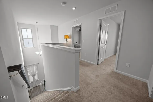 a view of a kitchen from the hallway