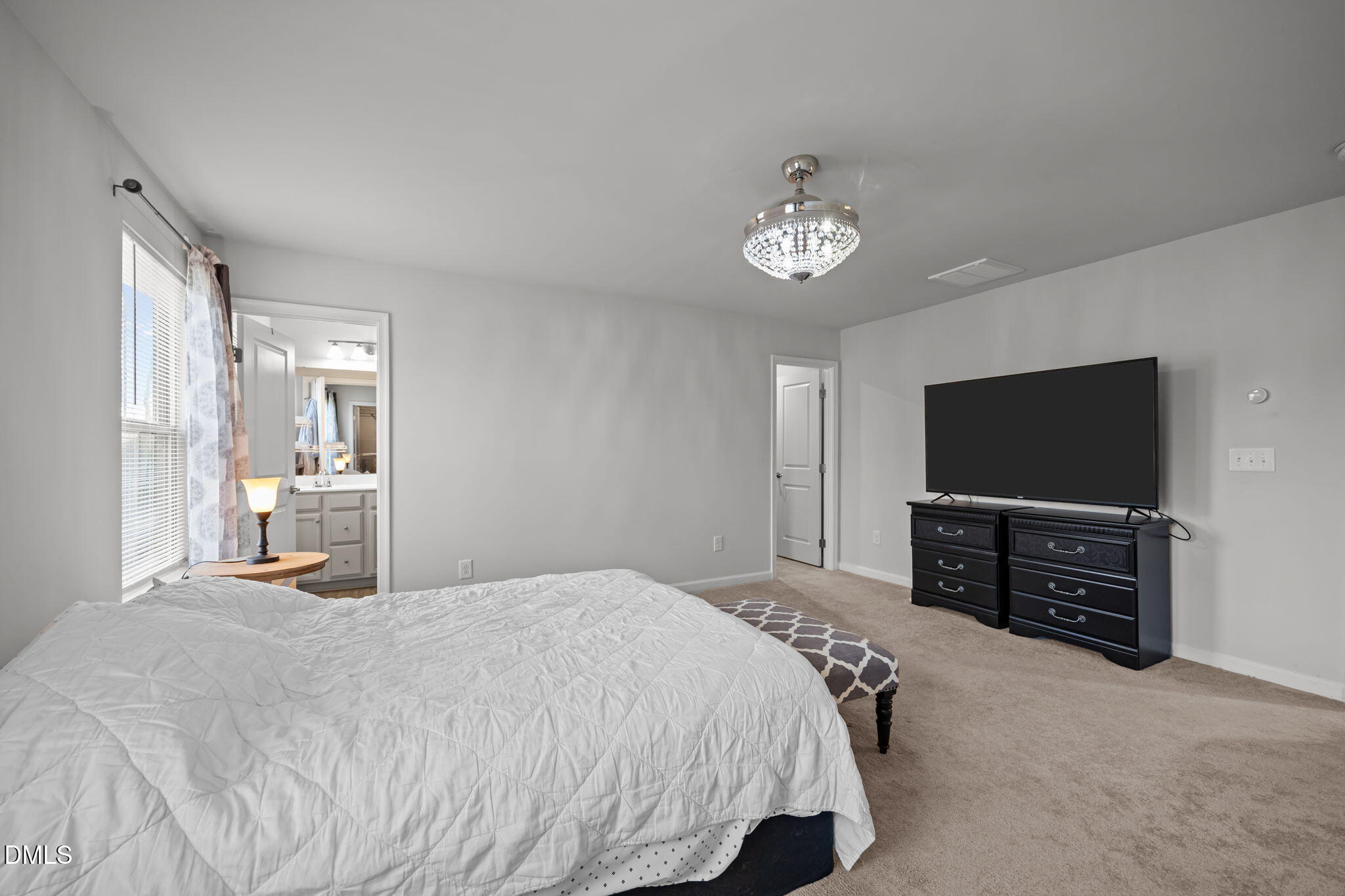 1624 Ripley Woods Street Wake Forest, NC 27587 - Photo 24 of 41 a bedroom with a bed and a flat screen tv