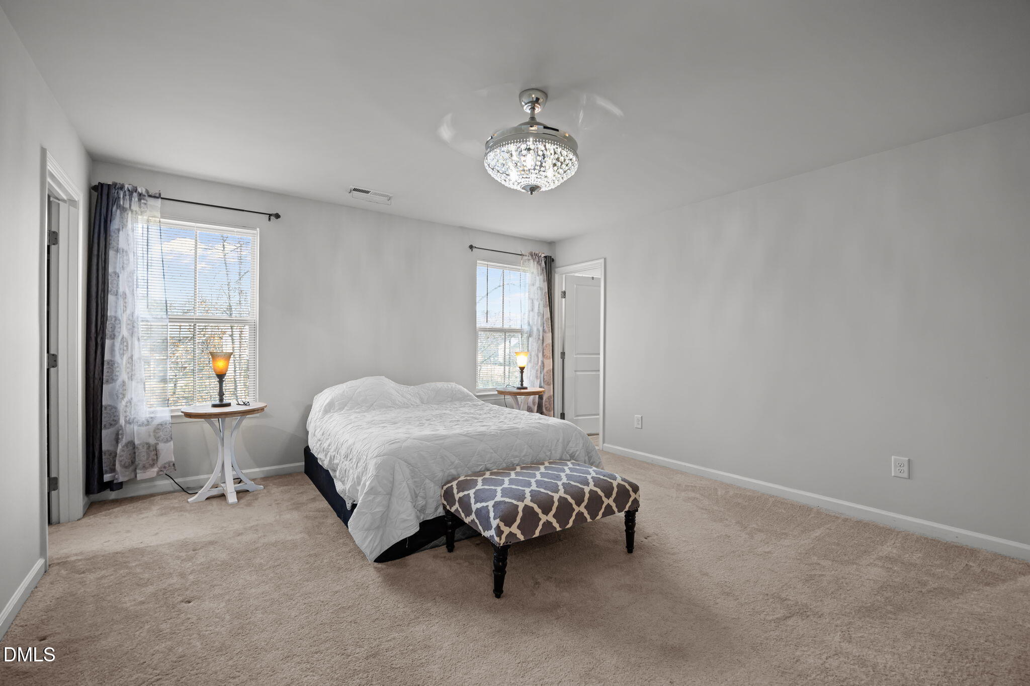 1624 Ripley Woods Street Wake Forest, NC 27587 - Photo 25 of 41 a bed sitting in a bedroom next to a window