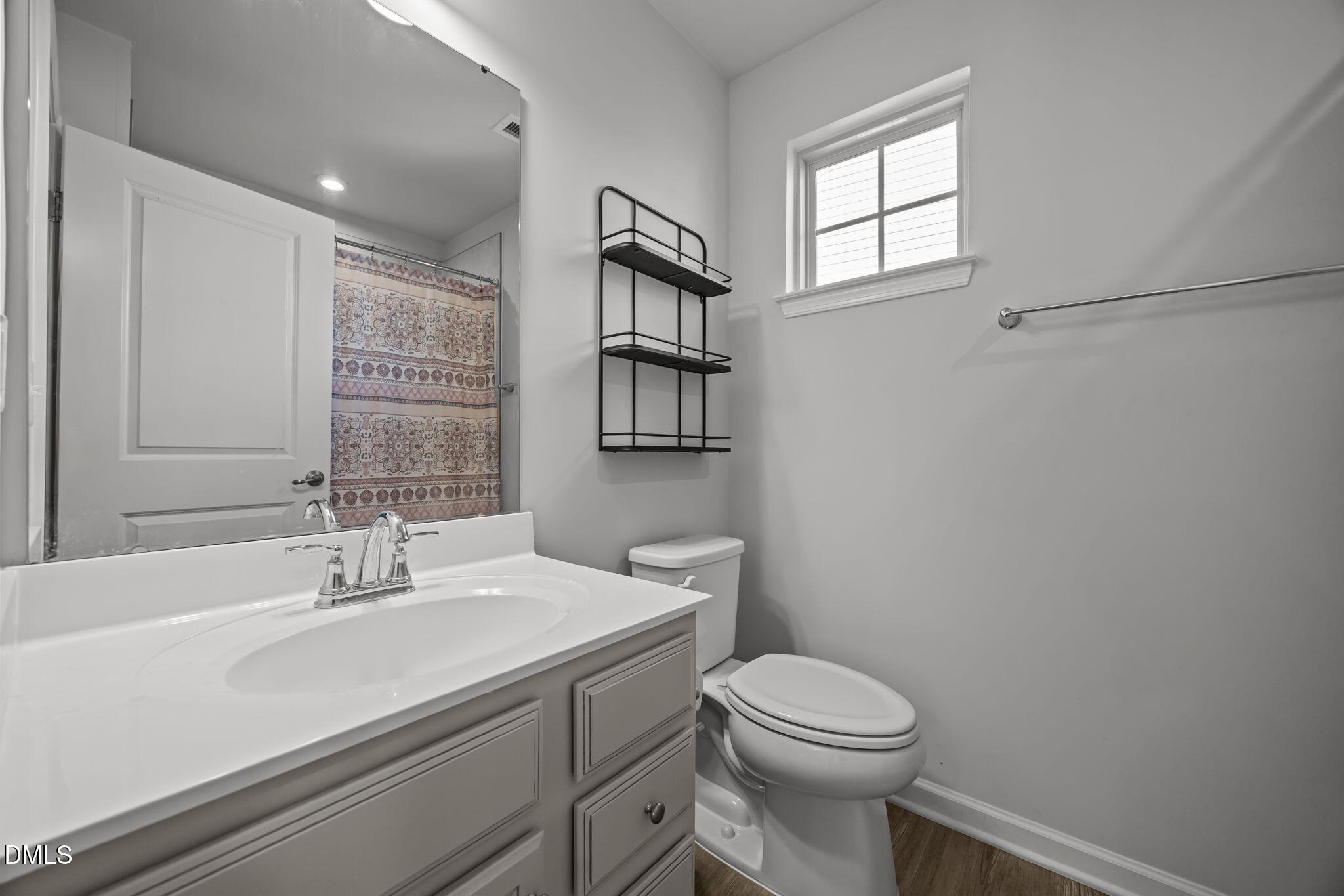 1624 Ripley Woods Street Wake Forest, NC 27587 - Photo 28 of 41 a bathroom with a sink a toilet and shower
