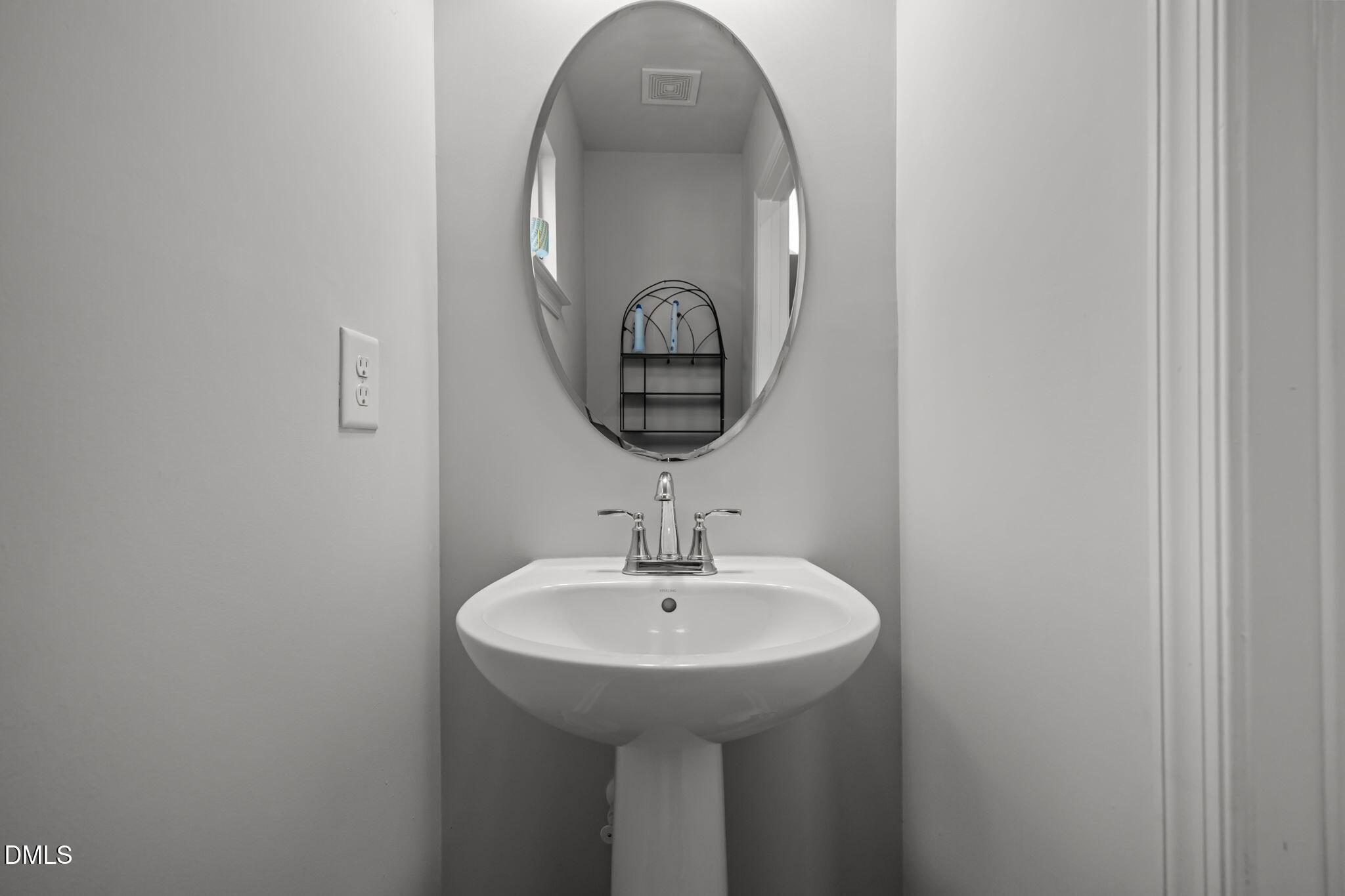 1624 Ripley Woods Street Wake Forest, NC 27587 - Photo 29 of 41 a bathroom with a sink and a mirror