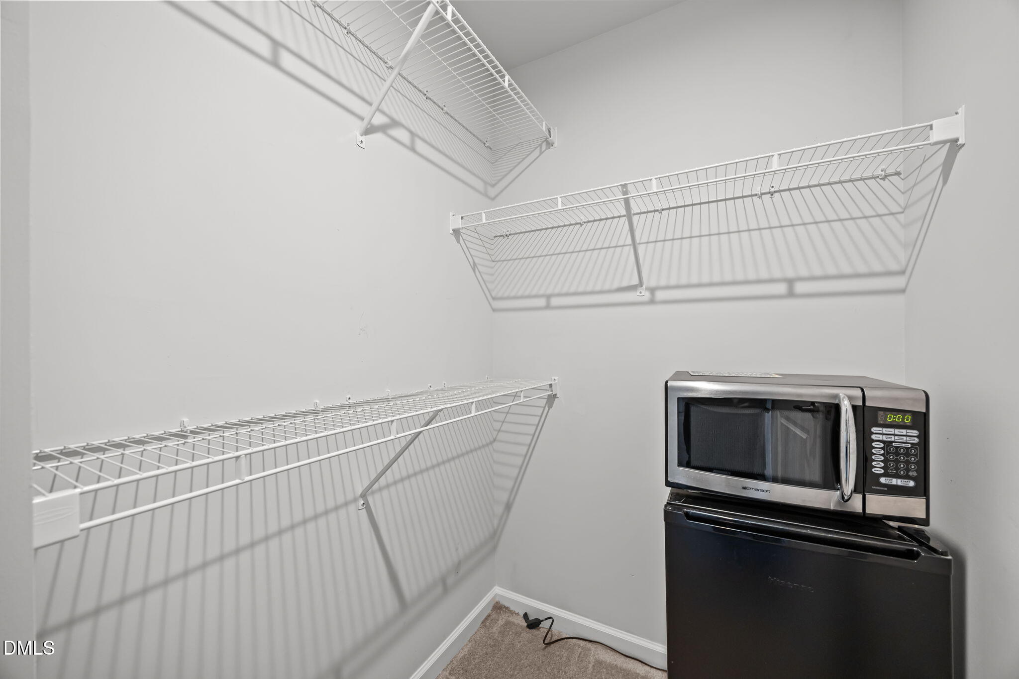1624 Ripley Woods Street Wake Forest, NC 27587 - Photo 30 of 41 a view of storage and utility room with racks on the wall