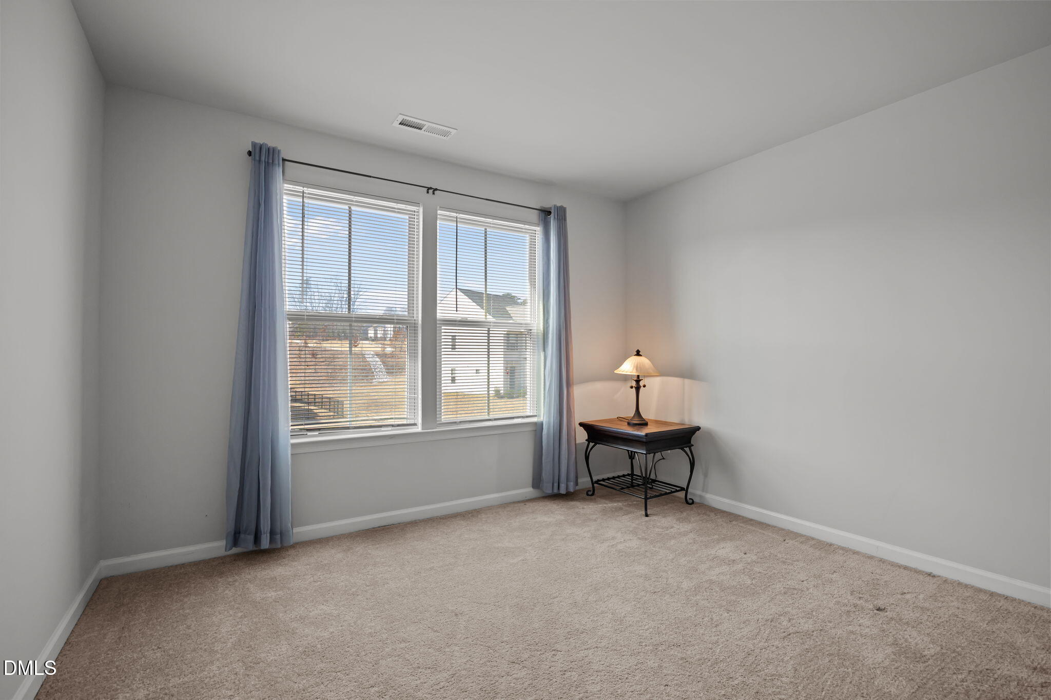 1624 Ripley Woods Street Wake Forest, NC 27587 - Photo 31 of 41 an empty room with a window