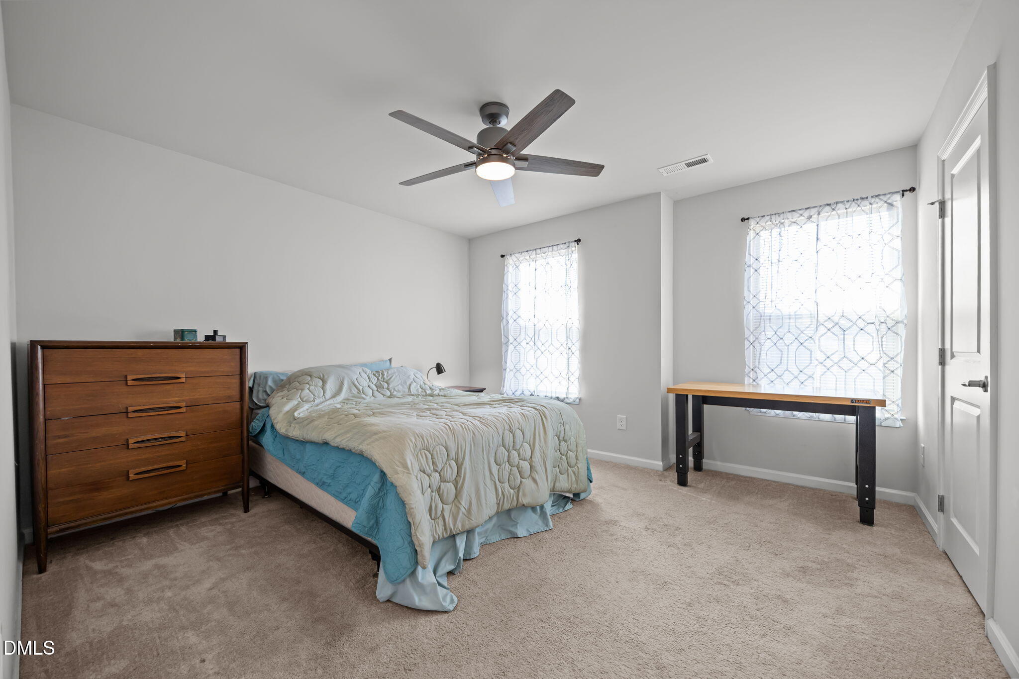 1624 Ripley Woods Street Wake Forest, NC 27587 - Photo 32 of 41 a spacious bedroom with a bed and a ceiling fan