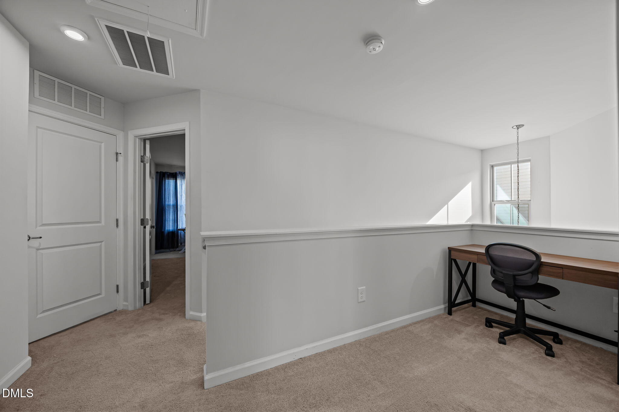 1624 Ripley Woods Street Wake Forest, NC 27587 - Photo 34 of 41 a view of a workspace with furniture and a window