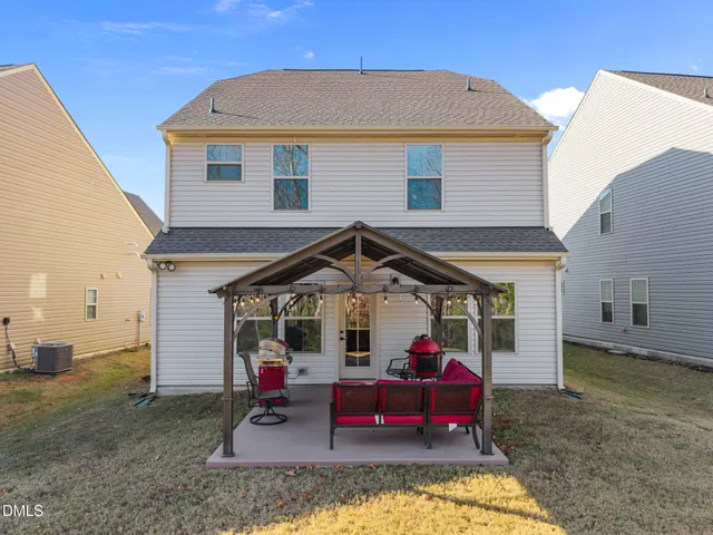 a view of a small house in the back yard
