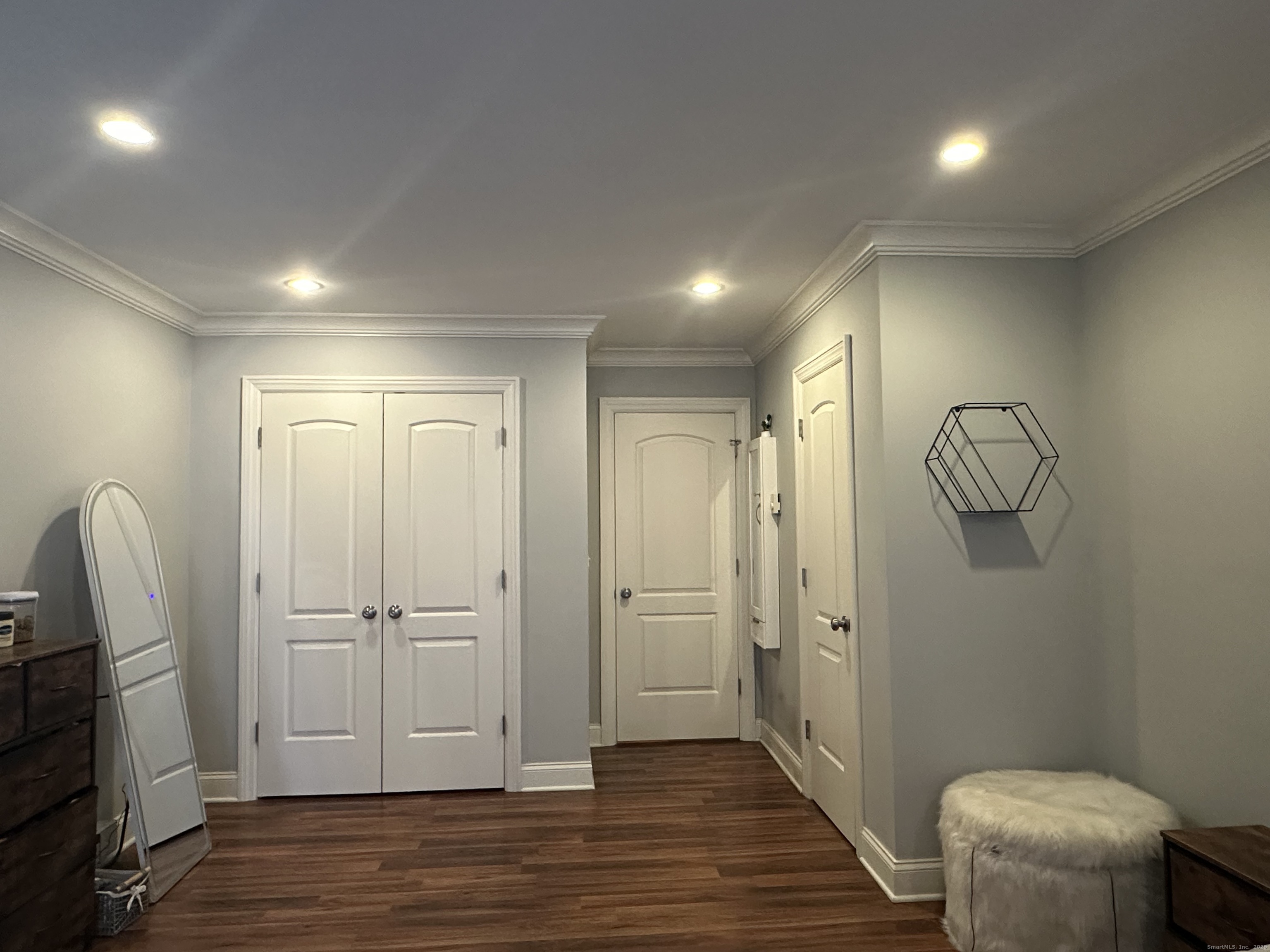 697 Cove Road, Unit 1E Stamford, CT 06902 - Photo 12 of 14 a view of empty room with wooden floor
