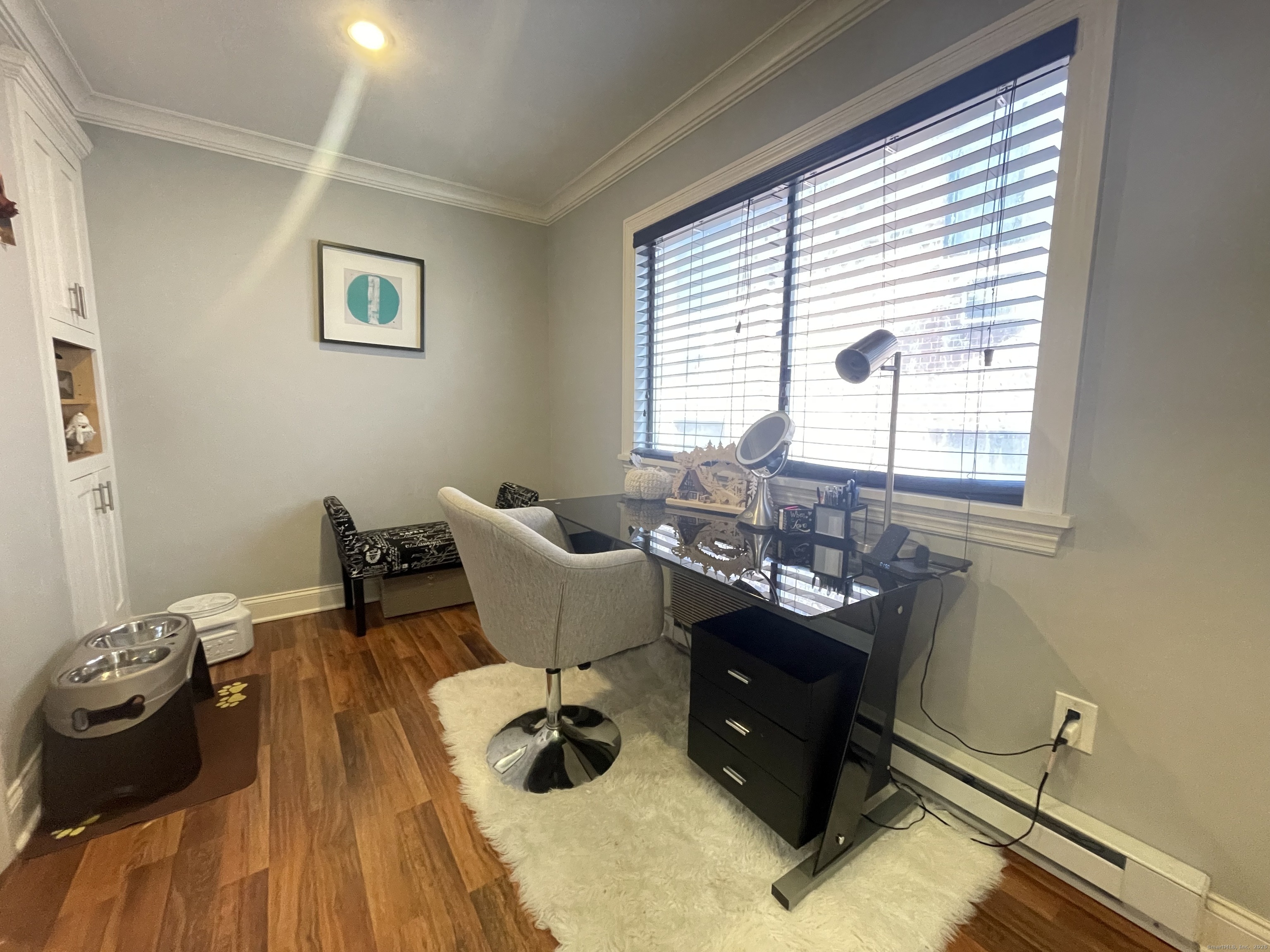 697 Cove Road, Unit 1E Stamford, CT 06902 - Photo 7 of 14 a living room with furniture and a window