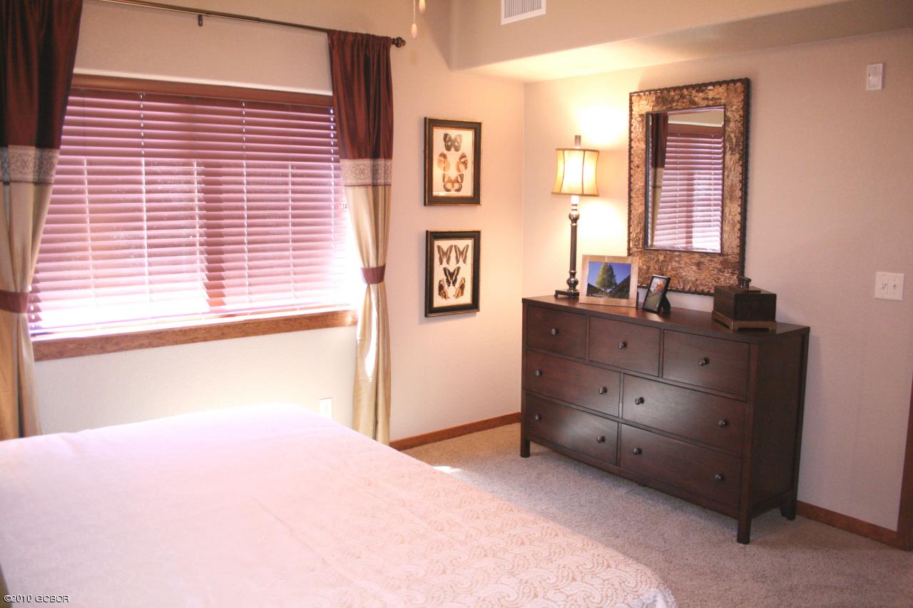 180 Sterling Loop, Unit 402 Fraser, CO 80442 - Photo 15 of 21 15 Sterling Pointe Model Master Bedroom