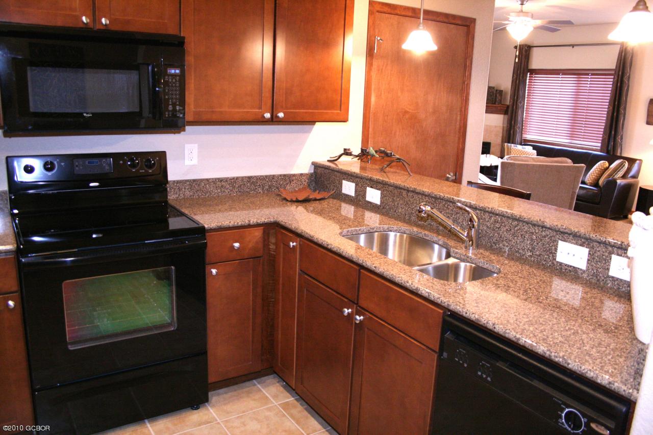 180 Sterling Loop, Unit 402 Fraser, CO 80442 - Photo 10 of 21 10 Sterling Pointe Model Kitchen Bar Sto