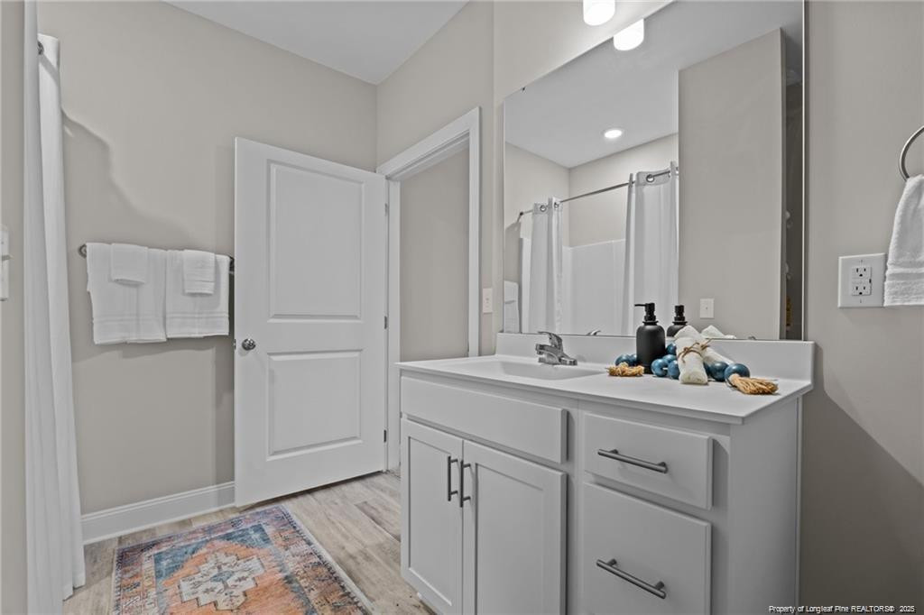 200 Gallery Drive, Unit 301 Spring Lake, NC 28390 - Photo 14 of 21 a bathroom with a sink and a mirror