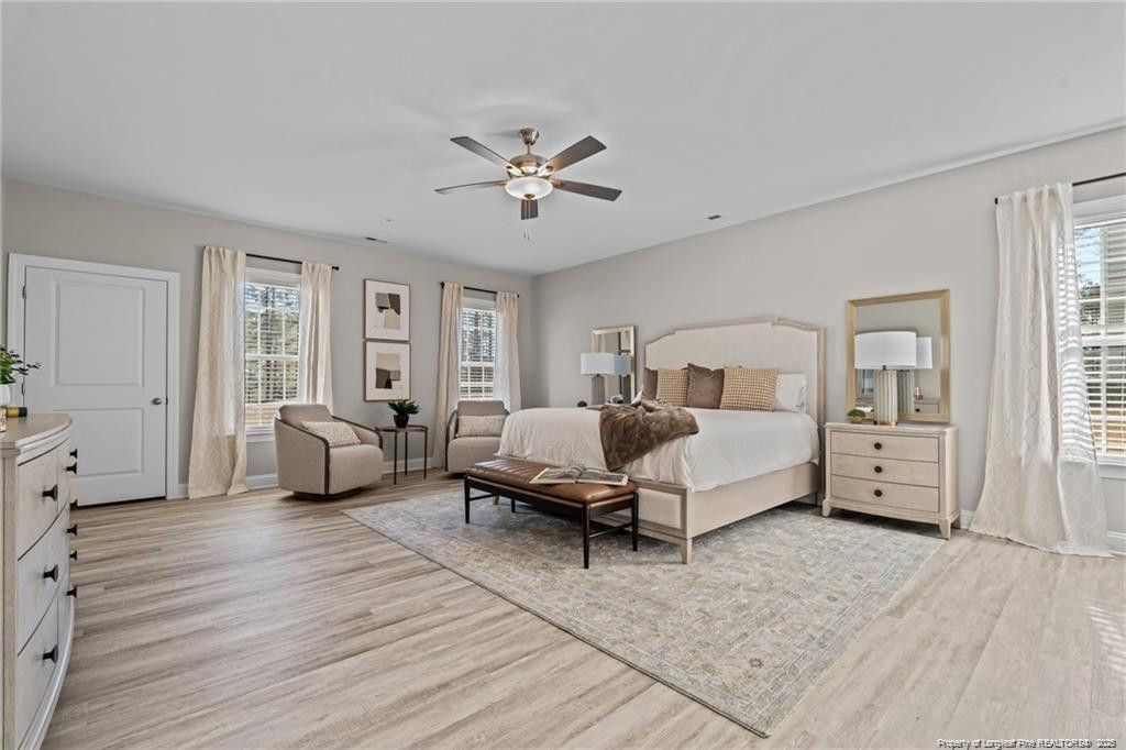 200 Gallery Drive, Unit 301 Spring Lake, NC 28390 - Photo 16 of 21 a bedroom with a bed couch and a window