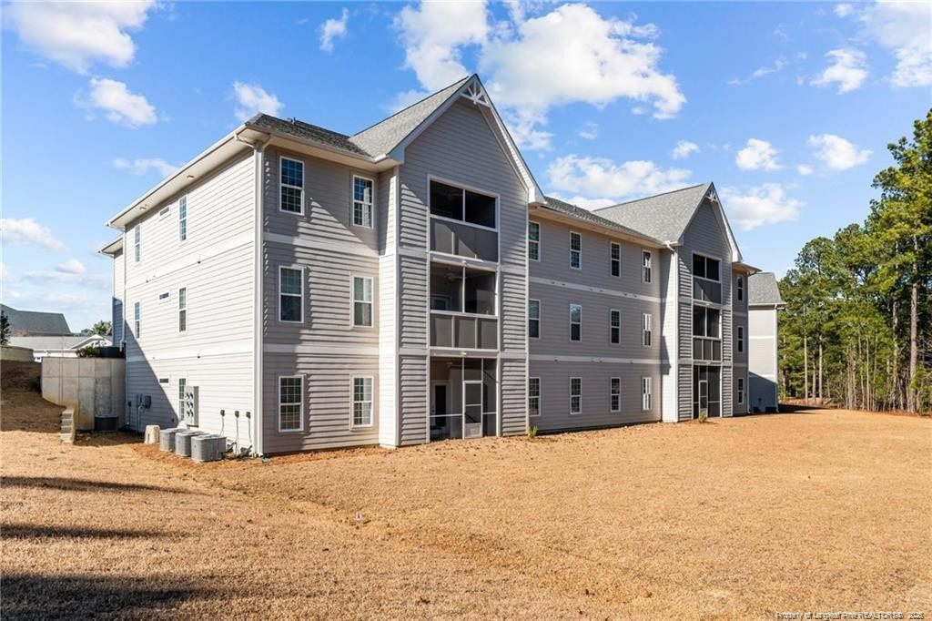 200 Gallery Drive, Unit 301 Spring Lake, NC 28390 - Photo 21 of 21 a front view of a house with a yard