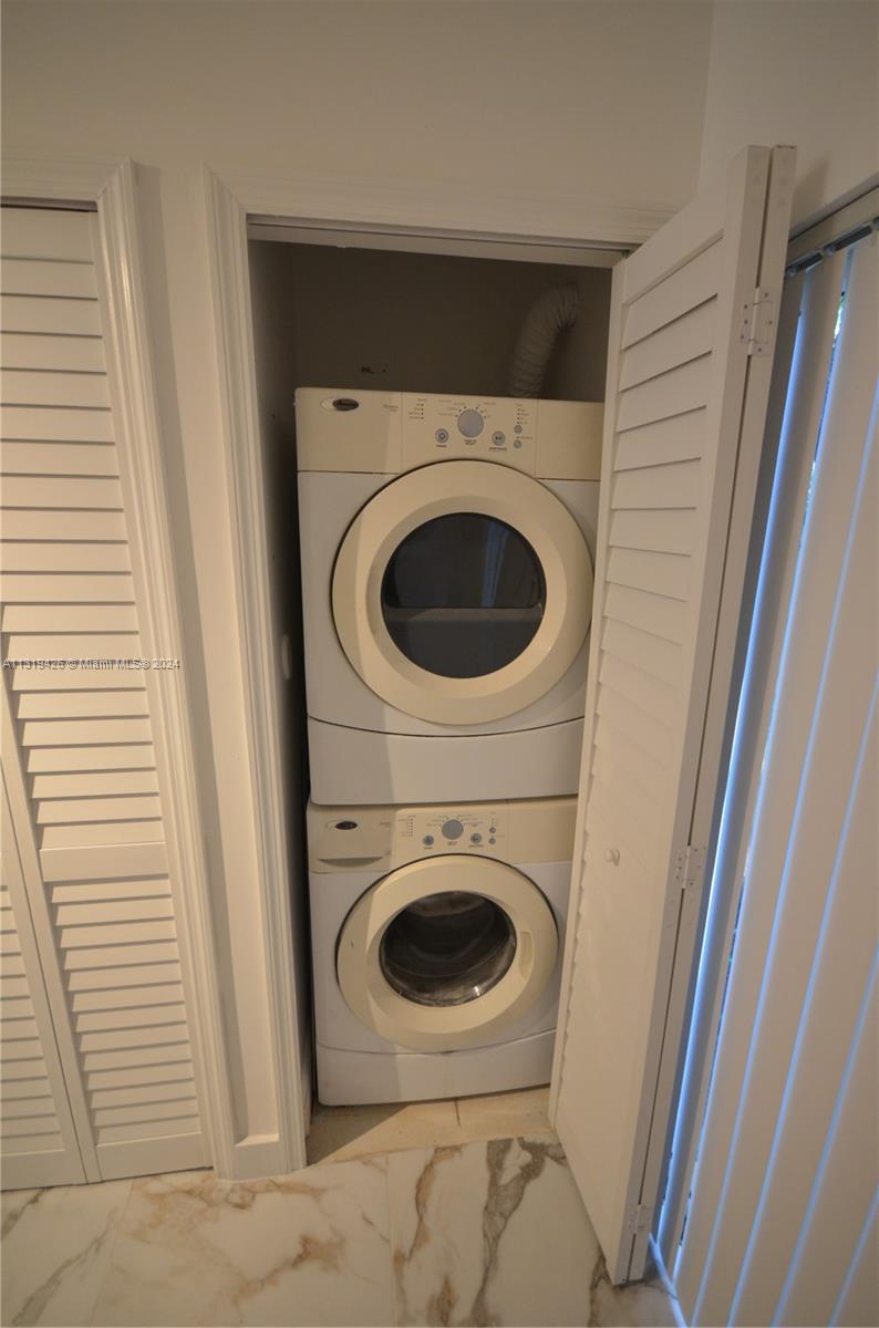 1241 Southeast 29th Street, Unit 102 Homestead, FL 33035 - Photo 14 of 23 a utility room with dryer and washer