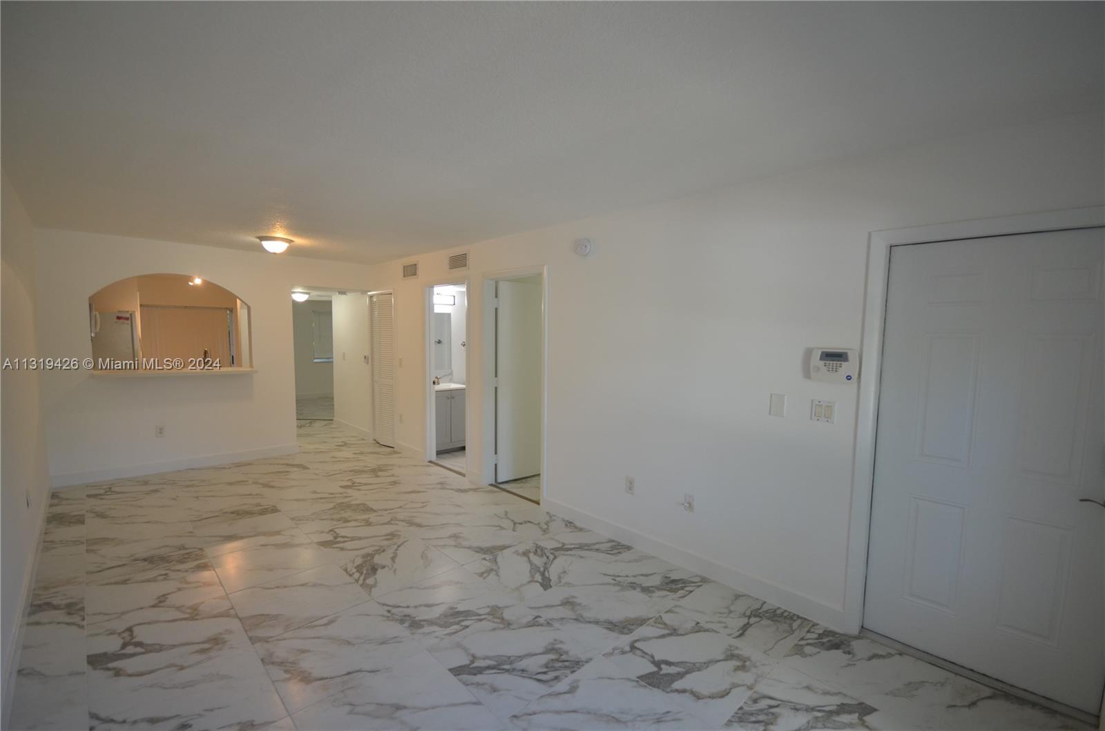 1241 Southeast 29th Street, Unit 102 Homestead, FL 33035 - Photo 4 of 23 a view of a hallway