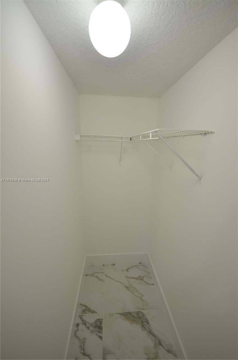 1241 Southeast 29th Street, Unit 102 Homestead, FL 33035 - Photo 8 of 23 a view of a small space